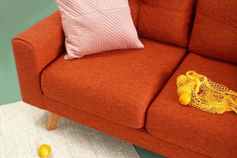 Person napping on a couch by daylight