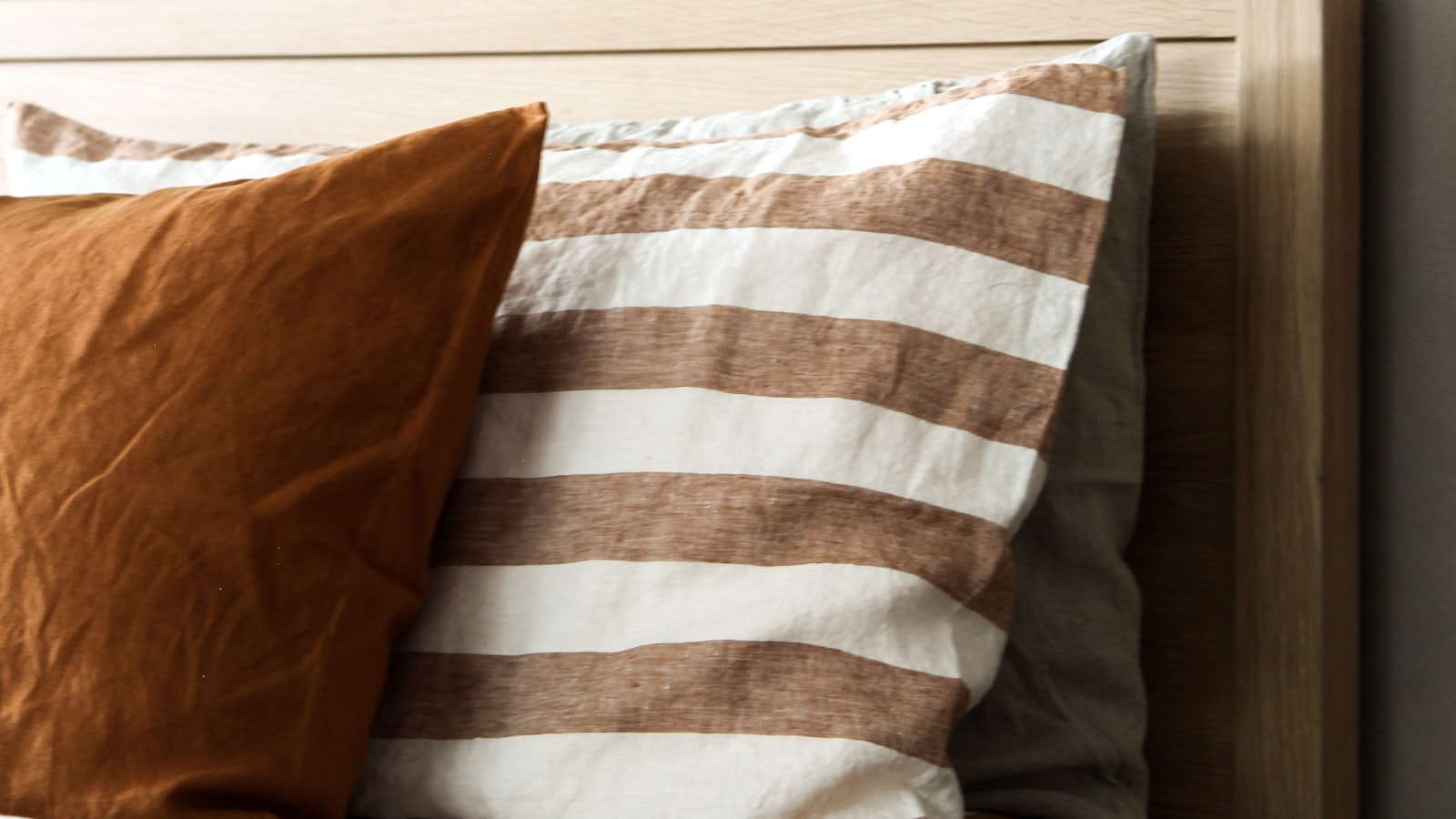 Small white noise machine on a nightstand